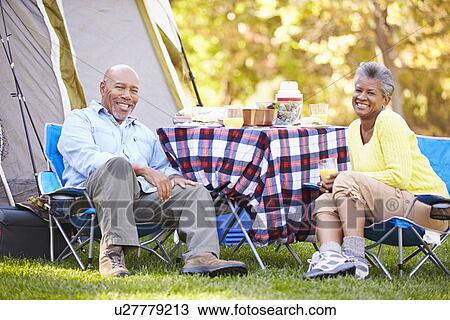 Senior Couple Enjoying Camping Holiday In Countryside View Large Photo Image Stock Image - Senior Couple Enjoying Camping Holiday In Countryside. Fotosearch
