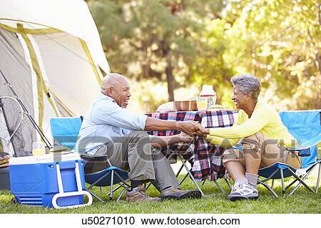 Senior Couple Enjoying Camping Holiday In Countryside View Large Photo Image Stock Image - Senior Couple Enjoying Camping Holiday In Countryside. Fotosearch