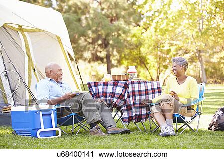 Senior Couple Enjoying Camping Holiday In Countryside View Large Photo Image Stock Image - Senior Couple Enjoying Camping Holiday In Countryside. Fotosearch