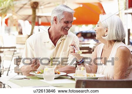 Senior Couple Enjoying Lunch In Outdoor Restaurant View Large Photo Image Stock Photograph - Senior Couple Enjoying Lunch In Outdoor Restaurant. Fotosearch