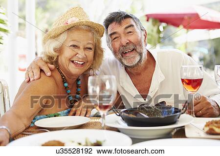 Senior Couple Enjoying Meal In Outdoor Restaurant View Large Photo Image Stock Image - Senior Couple Enjoying Meal In Outdoor Restaurant. Fotosearch