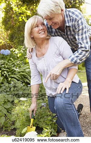 Stock Photography - Senior couple gardening. Fotosearch