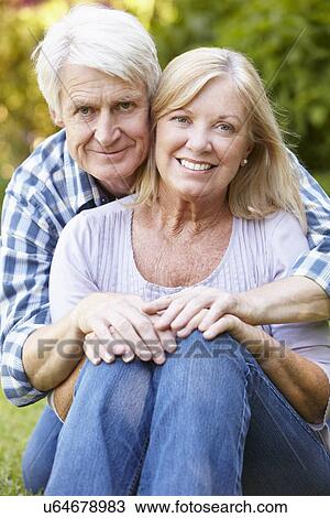 Stock Image - Senior couple in garden. Fotosearch