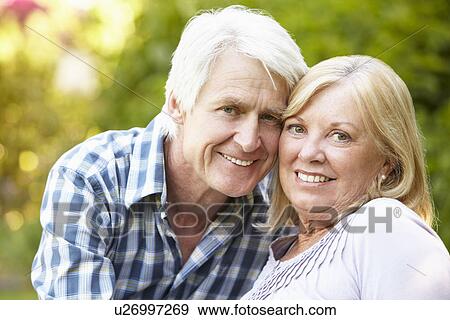 Stock Photo - Senior couple in garden. Fotosearch