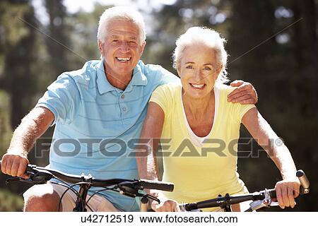 Stock Photo - Senior couple on bicycles. Fotosearch