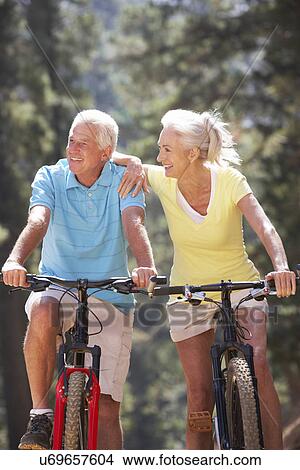Senior couple on country bike ride View Large Photo Image Picture - Senior couple on country bike ride. Fotosearch