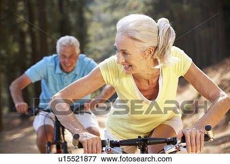 Stock Photo - Senior couple on country bike ride. Fotosearch