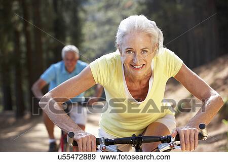 Senior couple on country bike ride View Large Photo Image Stock Photo - Senior couple on country bike ride. Fotosearch