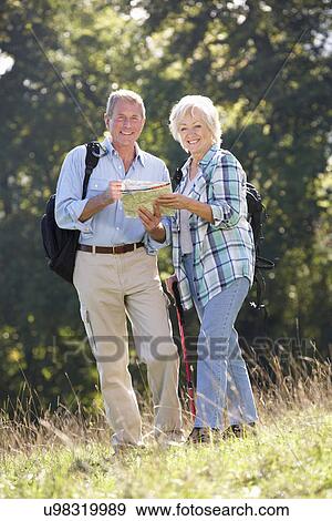 Stock Photo - Senior couple on country walk. Fotosearch