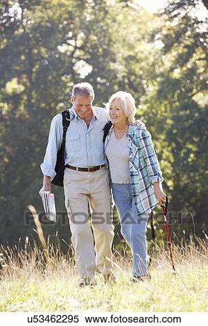 Stock Photography - Senior couple on country walk. Fotosearch