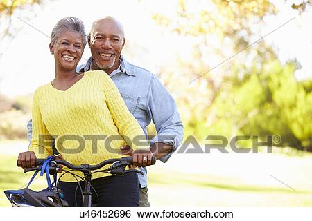Senior Couple On Cycle Ride In Countryside View Large Photo Image Stock Photograph - Senior Couple On Cycle Ride In Countryside. Fotosearch