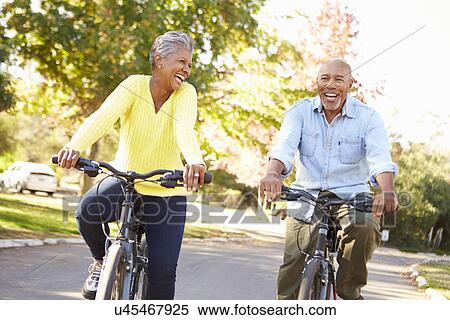 Senior Couple On Cycle Ride In Countryside View Large Photo Image Stock Photography - Senior Couple On Cycle Ride In Countryside. Fotosearch