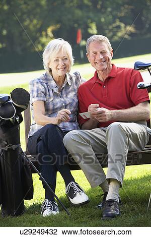 Senior couple on golf course View Large Photo Image Stock Image - Senior couple on golf course. Fotosearch