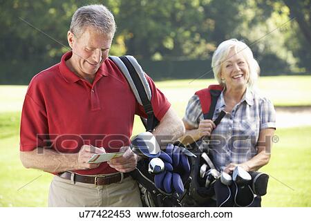 Senior couple on golf course View Large Photo Image Stock Image - Senior couple on golf course. Fotosearch