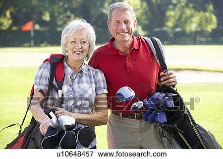 Senior couple on golf course View Large Photo Image Stock Photo - Senior couple on golf course. Fotosearch