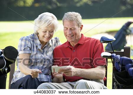Senior couple on golf course View Large Photo Image Stock Photo - Senior couple on golf course. Fotosearch