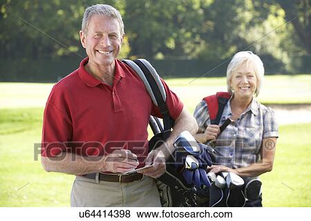 Senior couple on golf course View Large Photo Image Stock Photo - Senior couple on golf course. Fotosearch