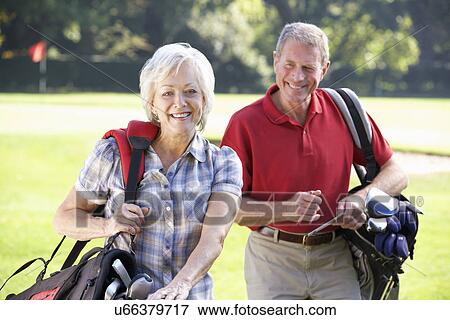 Senior couple on golf course View Large Photo Image Stock Photo - Senior couple on golf course. Fotosearch