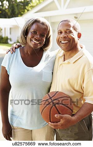 Senior Couple Playing Basketball Together View Large Photo Image Stock Photo - Senior Couple Playing Basketball Together. Fotosearch