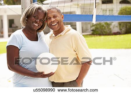 Senior Couple Playing Volleyball Together View Large Photo Image Stock Image - Senior Couple Playing Volleyball Together. Fotosearch
