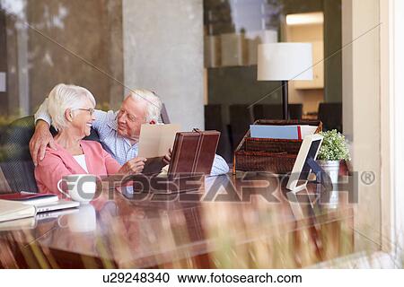 Senior Couple Putting Letter Into Keepsake Box View Large Photo Image Stock Image - Senior Couple Putting Letter Into Keepsake Box. Fotosearch