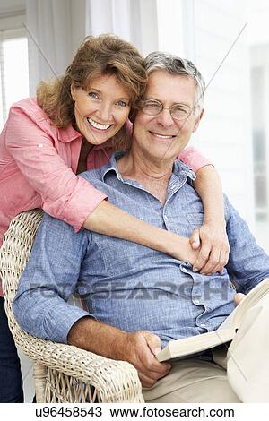 Senior couple relaxing at home View Large Photo Image Stock Image - Senior couple relaxing at home. Fotosearch