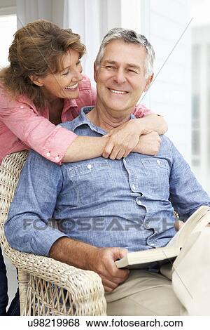 Senior couple relaxing at home View Large Photo Image Stock Photo - Senior couple relaxing at home. Fotosearch