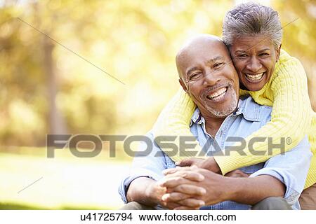 Picture - Senior Couple Relaxing In Autumn Landscape. Fotosearch