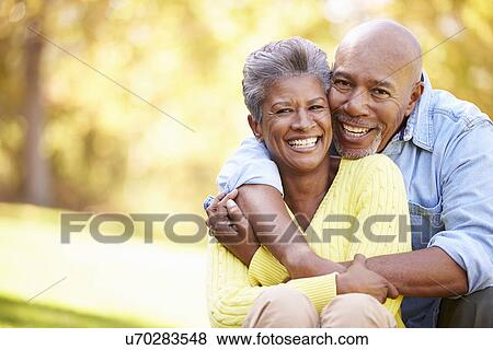 Senior Couple Relaxing In Autumn Landscape View Large Photo Image Stock Photo - Senior Couple Relaxing In Autumn Landscape. Fotosearch
