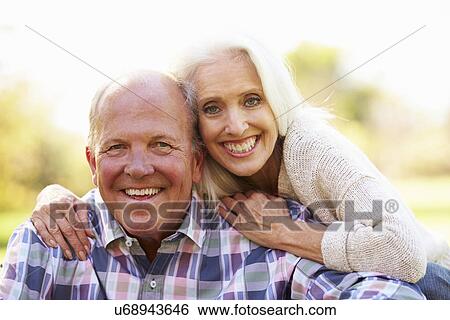 Senior Couple Relaxing In Autumn Landscape View Large Photo Image Stock Photograph - Senior Couple Relaxing In Autumn Landscape. Fotosearch
