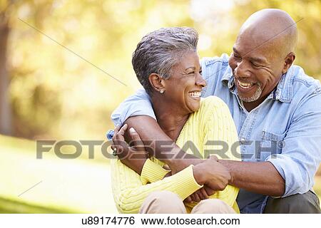 Senior Couple Relaxing In Autumn Landscape View Large Photo Image Stock Photograph - Senior Couple Relaxing In Autumn Landscape. Fotosearch