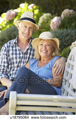 Senior couple relaxing in garden View Large Photo Image Picture - Senior couple relaxing in garden. Fotosearch