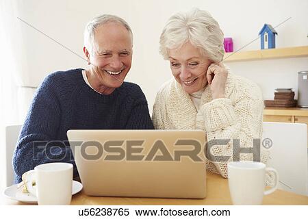 Senior Couple Using Laptop To Shop Online View Large Photo Image Stock Photography - Senior Couple Using Laptop To Shop Online. Fotosearch