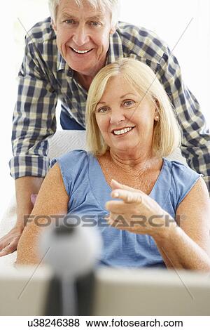 Senior couple using skype View Large Photo Image Stock Photo - Senior couple using skype. Fotosearch