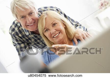 Stock Photography - Senior couple using skype. Fotosearch