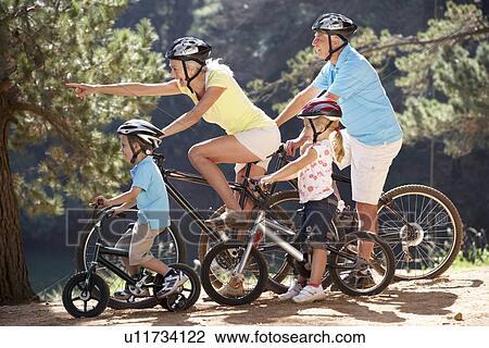 Senior couple with grandchildren on country bike ride View Large Photo Image Stock Image - Senior couple with grandchildren on country bike ride. Fotosearch