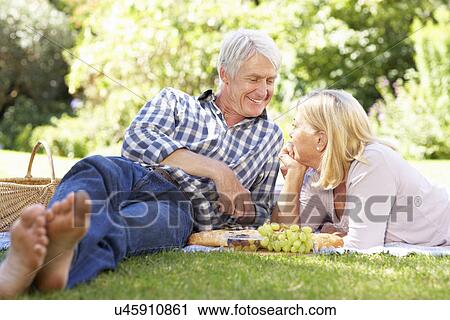 Senior couple with picnic in park View Large Photo Image Stock Image - Senior couple with picnic in park. Fotosearch