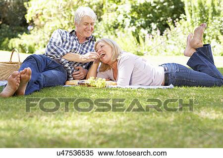 Senior couple with picnic in park View Large Photo Image Stock Photography - Senior couple with picnic in park. Fotosearch