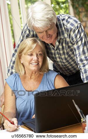 Senior Couple Working In Home Office View Large Photo Image Stock Image - Senior Couple Working In Home Office. Fotosearch