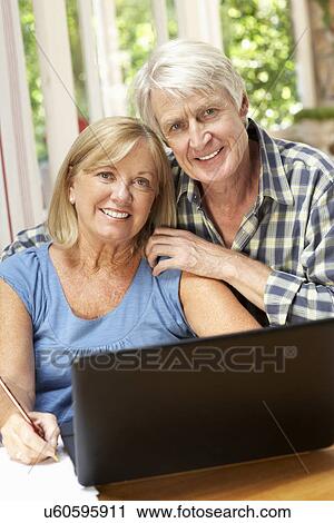 Senior Couple Working In Home Office View Large Photo Image Stock Image - Senior Couple Working In Home Office. Fotosearch