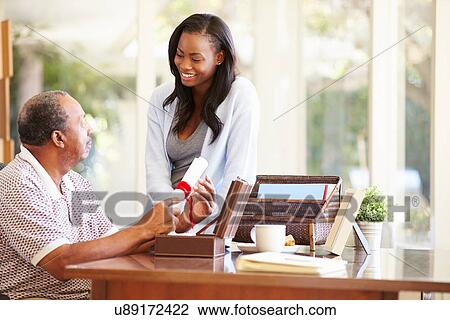 Senior Father Discussing Document With Adult Daughter View Large Photo Image Stock Image - Senior Father Discussing Document With Adult Daughter. Fotosearch