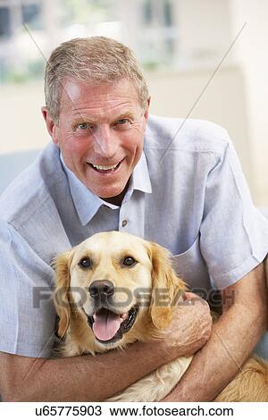Senior man at home with dog View Large Photo Image Stock Image - Senior man at home with dog. Fotosearch