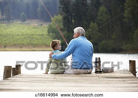 Senior man fishing with grandson View Large Photo Image Picture - Senior man fishing with grandson. Fotosearch