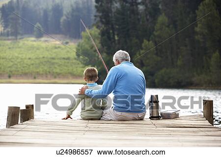 Senior man fishing with grandson View Large Photo Image Stock Photo - Senior man fishing with grandson. Fotosearch