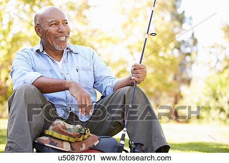 Senior Man On Camping Holiday With Fishing Rod View Large Photo Image Stock Image - Senior Man On Camping Holiday With Fishing Rod. Fotosearch