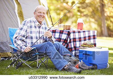 Senior Man On Camping Holiday With Fishing Rod View Large Photo Image Stock Image - Senior Man On Camping Holiday With Fishing Rod. Fotosearch