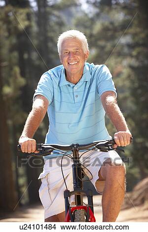 Picture - Senior man on country bike ride. Fotosearch