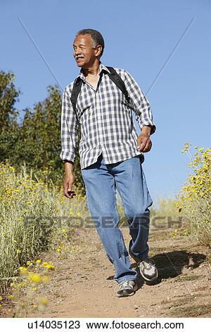Senior man on country hike View Large Photo Image Stock Image - Senior man on country hike. Fotosearch
