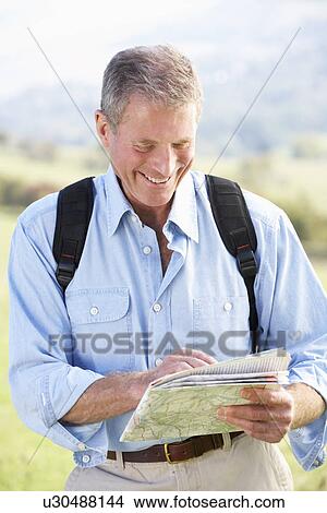 Picture - Senior man on country walk. Fotosearch