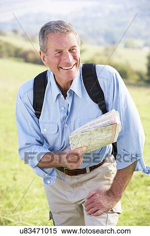 Stock Photography - Senior man on country walk. Fotosearch